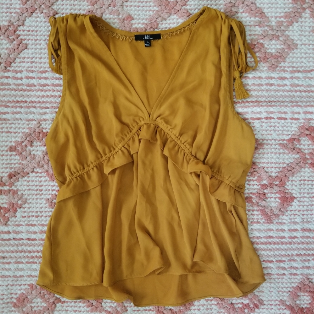 Yellow blouse with tassels